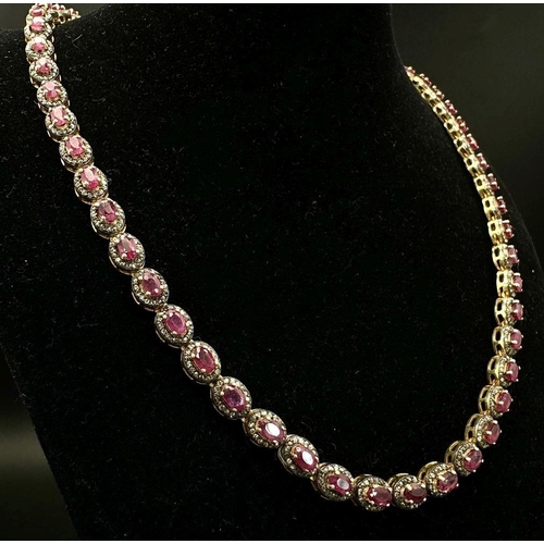 163 - A Ruby and Diamond Tennis Necklace and Drop Earrings Set. Oval cut deep red rubies each with an old ... 