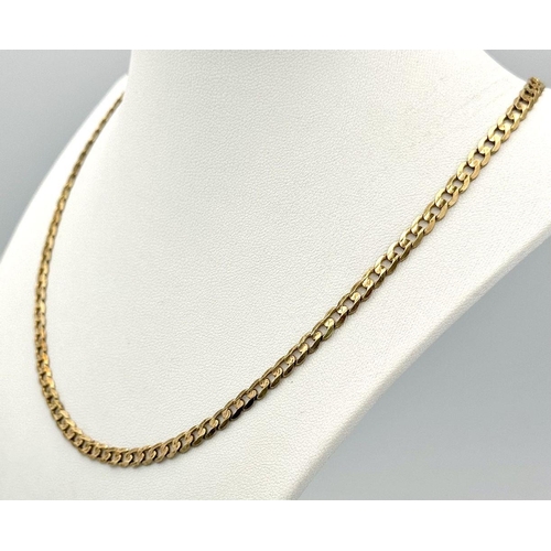 17 - A 9K Yellow Gold Flat Curb Link Chain. 44cm length. 10.9g weight.