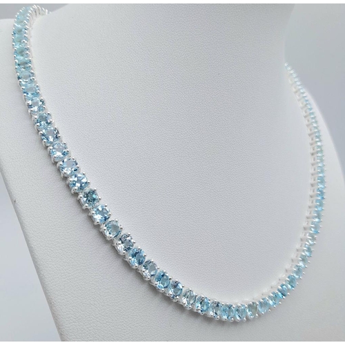 176 - A Blue Topaz Tennis Necklace - Set in 925 Silver. 45cm length. CD - 1491