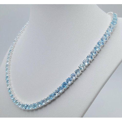 176 - A Blue Topaz Tennis Necklace - Set in 925 Silver. 45cm length. CD - 1491