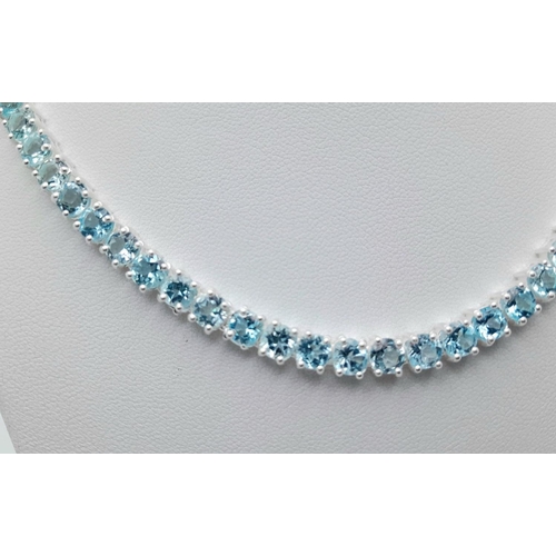 176 - A Blue Topaz Tennis Necklace - Set in 925 Silver. 45cm length. CD - 1491