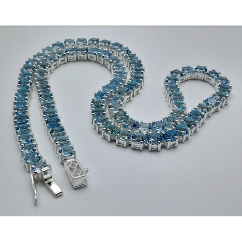 176 - A Blue Topaz Tennis Necklace - Set in 925 Silver. 45cm length. CD - 1491