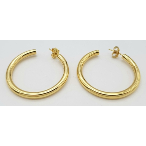 18 - A PAIR OF TIFFANY AND CO 18K YELLOW GOLD HOOP EARRINGS WITH ORIGINAL TIFFANY AND CO BUTTERFLY BACKS.... 