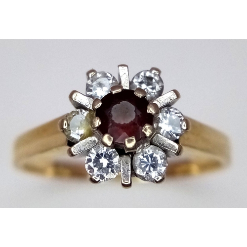 193 - AN 18K YELLOW GOLD DIAMOND AND RED STONE RING. 0.20CT. 3.4G. SIZE K. SC3064.