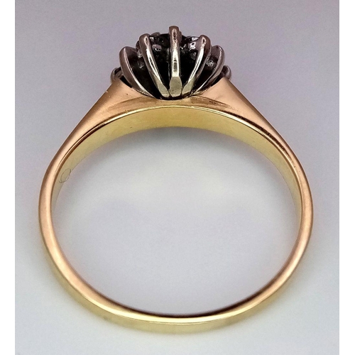 193 - AN 18K YELLOW GOLD DIAMOND AND RED STONE RING. 0.20CT. 3.4G. SIZE K. SC3064.