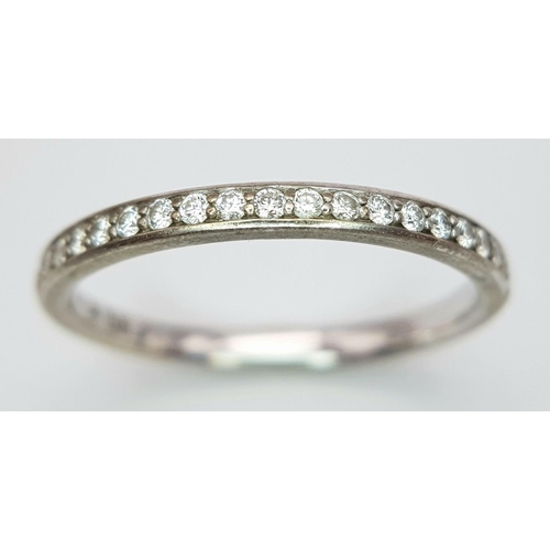 200 - AN 18K WHITE GOLD DIAMOND SET BAND RING - 0.20CTW. 2.5G. SIZE O. A/S 1153.