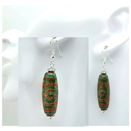 203 - A mini-Tibetan treasure of three pairs of earrings: one is a three-eye green & brown elongate Dzi ag... 