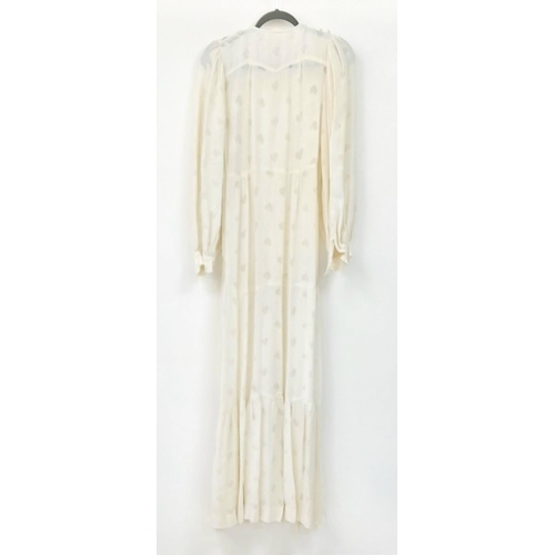 205 - A Vintage ivory Ossie Clark floor length dress, heart details to the fabric, clothed buttons to fast... 