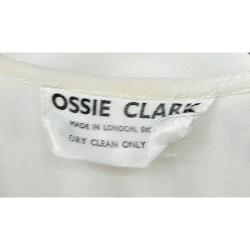 205 - A Vintage ivory Ossie Clark floor length dress, heart details to the fabric, clothed buttons to fast... 