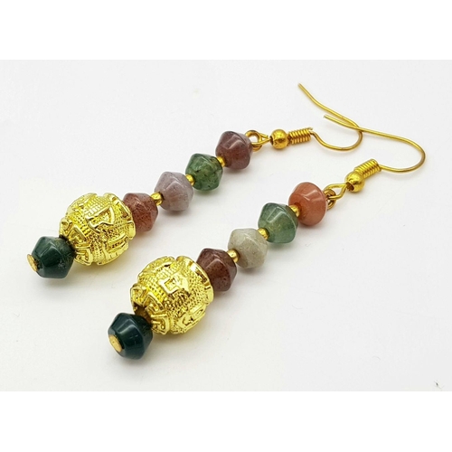 224 - A fascinating three strand necklace with multi-coloured, faceted, round Malaysian Jade beads with go... 