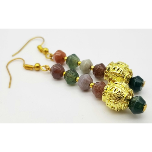 224 - A fascinating three strand necklace with multi-coloured, faceted, round Malaysian Jade beads with go... 