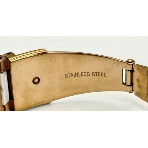 231 - A rose gold plated, Ceramic DKNY Chronometer watch, 38 mm case, bezel with cubic zirconia, white dia... 