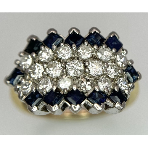 33 - AN 18K YELLOW GOLD, DIAMOND AND SAPPHIRE RING. 1CTW OF DIAMONDS AND 0.80CTW OF SAPPHIRES. 5.7G. SIZE... 