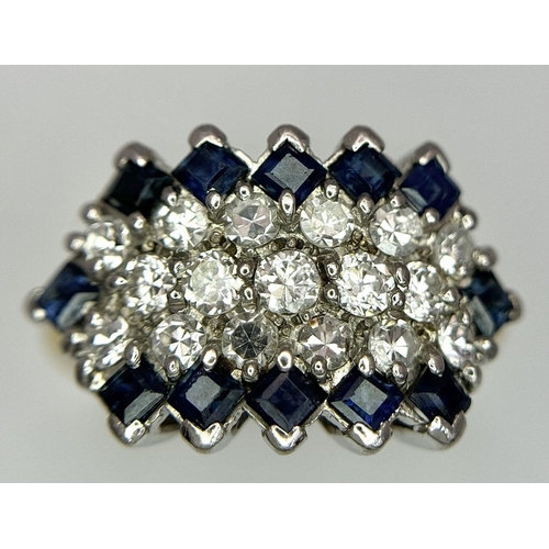 33 - AN 18K YELLOW GOLD, DIAMOND AND SAPPHIRE RING. 1CTW OF DIAMONDS AND 0.80CTW OF SAPPHIRES. 5.7G. SIZE... 