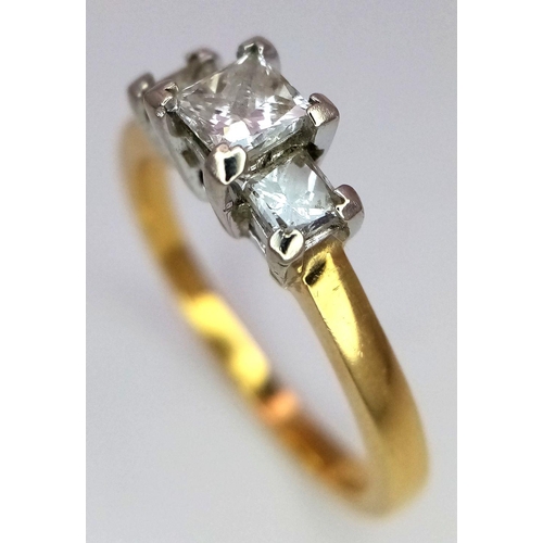 40 - AN 18K YELLOW GOLD 3 STONE DIAMOND RING. PRINCESS CUTS. 0.60CTW. 3.7G. SIZE N. GW3005.