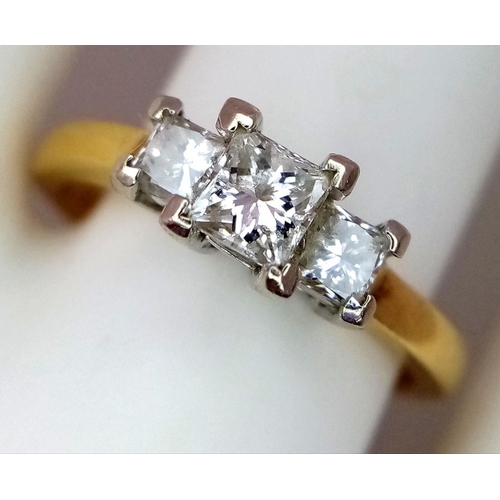 40 - AN 18K YELLOW GOLD 3 STONE DIAMOND RING. PRINCESS CUTS. 0.60CTW. 3.7G. SIZE N. GW3005.