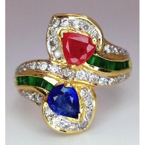 54 - AN 18K YELLOW GOLD DIAMOND, SAPPHIRE, RUBY & EMERALD TWIST RING. 6.6G. SIZE J. A/S SC17.