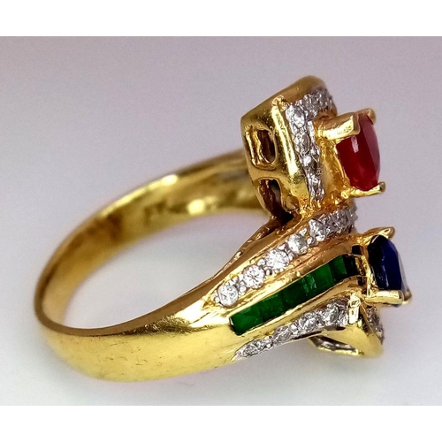 54 - AN 18K YELLOW GOLD DIAMOND, SAPPHIRE, RUBY & EMERALD TWIST RING. 6.6G. SIZE J. A/S SC17.