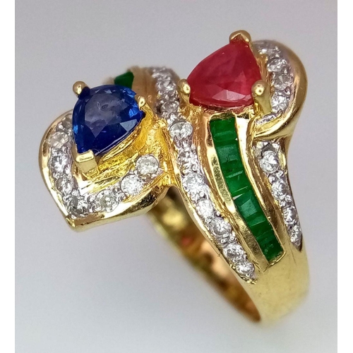 54 - AN 18K YELLOW GOLD DIAMOND, SAPPHIRE, RUBY & EMERALD TWIST RING. 6.6G. SIZE J. A/S SC17.