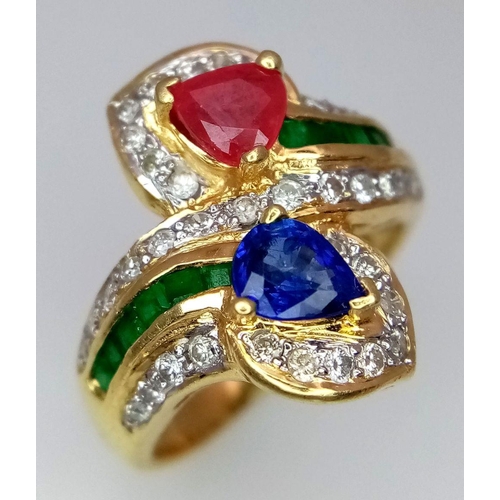 54 - AN 18K YELLOW GOLD DIAMOND, SAPPHIRE, RUBY & EMERALD TWIST RING. 6.6G. SIZE J. A/S SC17.