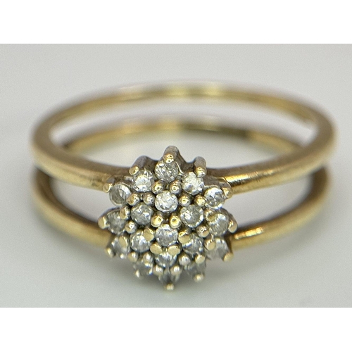 593 - A 9K YELLOW GOLD DIAMOND SPLIT SHANK CLUSTER RING. 0.20CT. 2.4G. SIZE L. SC3002.