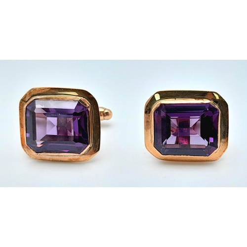 596 - A Pair of 9K Yellow Gold Amethyst Cufflinks. Rectangular step cut. 11.3g total weight.