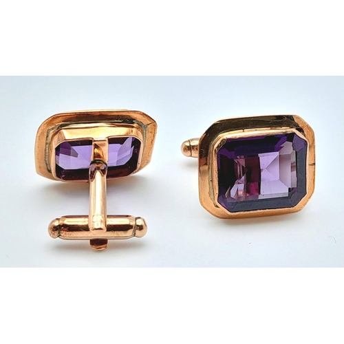 596 - A Pair of 9K Yellow Gold Amethyst Cufflinks. Rectangular step cut. 11.3g total weight.