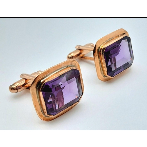 596 - A Pair of 9K Yellow Gold Amethyst Cufflinks. Rectangular step cut. 11.3g total weight.