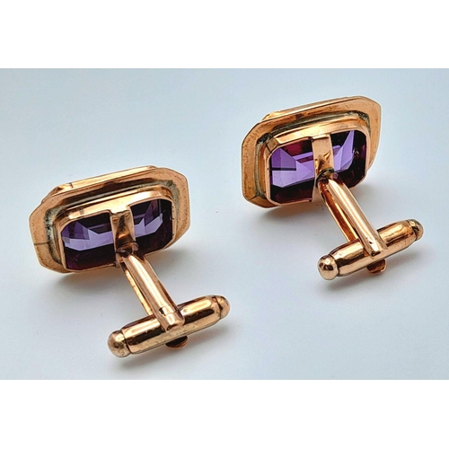 596 - A Pair of 9K Yellow Gold Amethyst Cufflinks. Rectangular step cut. 11.3g total weight.