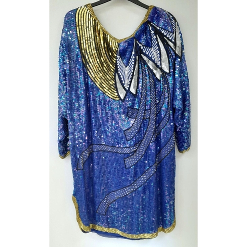 603 - A vintage sequin tunic dress, fabulous 80's shoulder pads, fully lined, fits a UK size 12. Please se... 