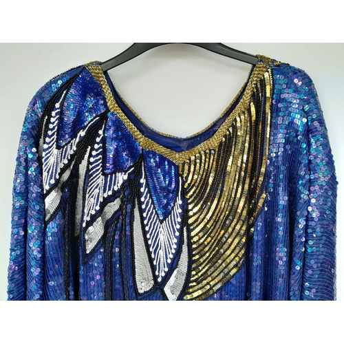 603 - A vintage sequin tunic dress, fabulous 80's shoulder pads, fully lined, fits a UK size 12. Please se... 