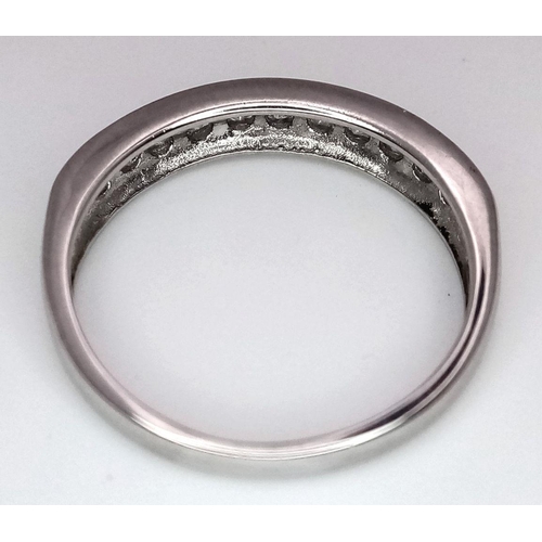 607 - A 9K WHITE GOLD DIAMOND HALF ETERNITY RING. 0.25CTW. 1.8G. SIZE J. SC3007.