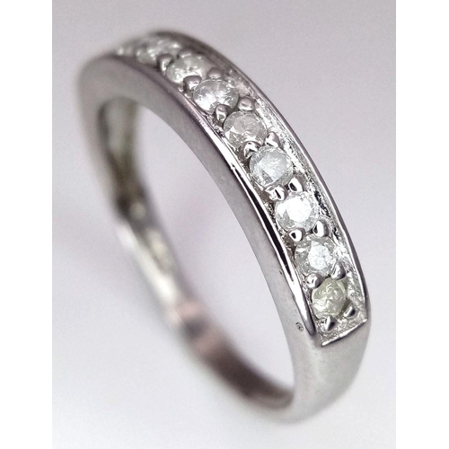 607 - A 9K WHITE GOLD DIAMOND HALF ETERNITY RING. 0.25CTW. 1.8G. SIZE J. SC3007.