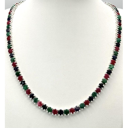 611 - A Ruby, Emerald and Sapphire Tennis Necklace - Set in 925 Silver. 45cm length. CD-1495