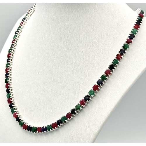 611 - A Ruby, Emerald and Sapphire Tennis Necklace - Set in 925 Silver. 45cm length. CD-1495