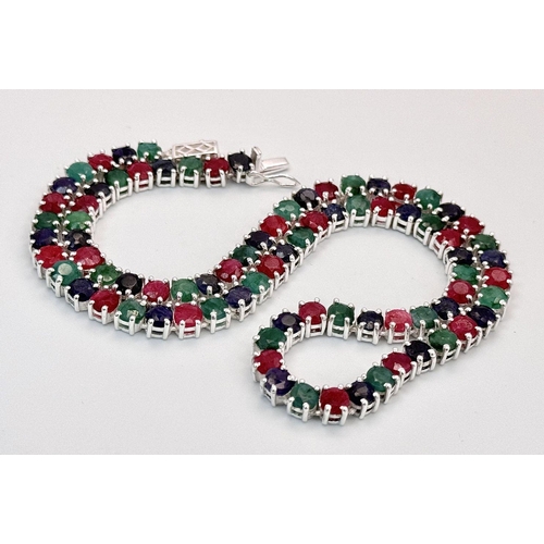 611 - A Ruby, Emerald and Sapphire Tennis Necklace - Set in 925 Silver. 45cm length. CD-1495