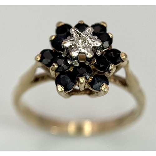 614 - A 9K YELLOW GOLD DIAMOND & SAPPHIRE RING. 2G. SIZE J.
SC3008.