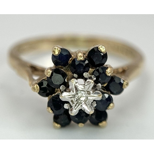 614 - A 9K YELLOW GOLD DIAMOND & SAPPHIRE RING. 2G. SIZE J.
SC3008.