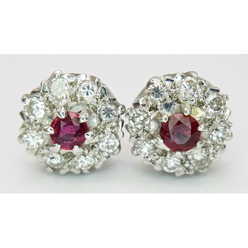 75 - A PAIR OF 18K WHITE GOLD DIAMOND & RUBY CLUSTER STUD EARRINGS. 0.50CTS DIAMONDS. 4.2G. SP3011.