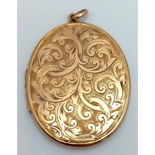 8 - A Vintage 9K Yellow Gold Large Oval Locket Pendant. Decorative scrolled engraving. 6cm. 19.7g weight... 