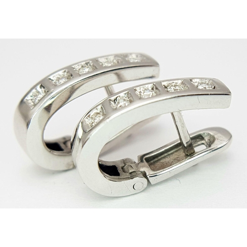 186 - A PAIR 18K WHITE GOLD DIAMOND SET EARRINGS - 0.15CTW. 4.2G. SC3063.