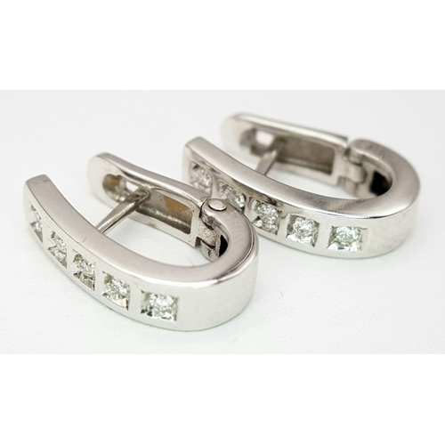186 - A PAIR 18K WHITE GOLD DIAMOND SET EARRINGS - 0.15CTW. 4.2G. SC3063.