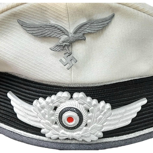 27 - A WW2 Luftwaffe White Topped Tropical Officers Visor Cap.