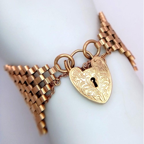 31 - A 9K Yellow Gold Gate Bracelet with Substantial Width and a Heart Clasp. 4cm width. 16cm length. One... 