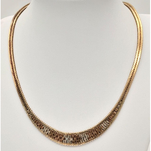 38 - A Glamourous Tri-Colour 9K Gold Necklace. Mesh design in herringbone form. 42cm length. 31g.