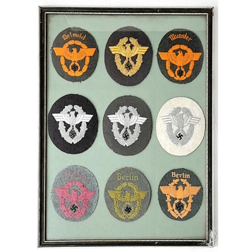 201 - A Framed set of 9 Ordnungspolizei Sleeve Badges. Either a private collection or tailor’s display.