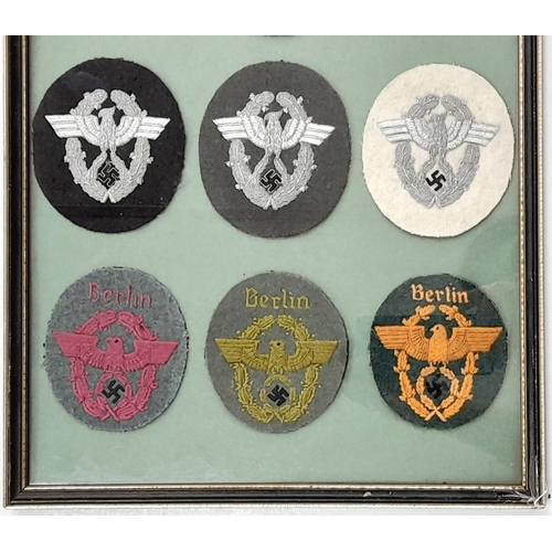 201 - A Framed set of 9 Ordnungspolizei Sleeve Badges. Either a private collection or tailor’s display.