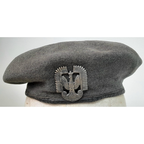 208 - A WW2 1944 Dated British Made RAF Beret with a Polish in exile Airforce cap badge. The badge is mark... 