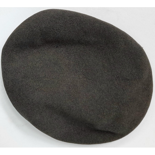 208 - A WW2 1944 Dated British Made RAF Beret with a Polish in exile Airforce cap badge. The badge is mark... 