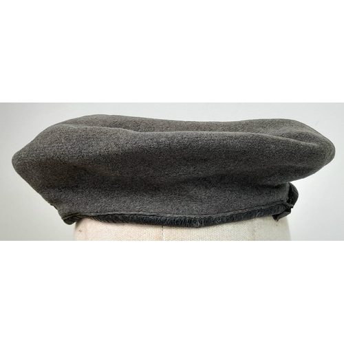 208 - A WW2 1944 Dated British Made RAF Beret with a Polish in exile Airforce cap badge. The badge is mark... 